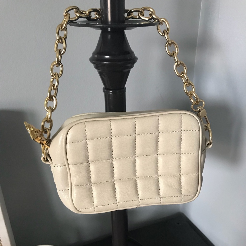 BCBG MAZAZRIA cream purse with gold
